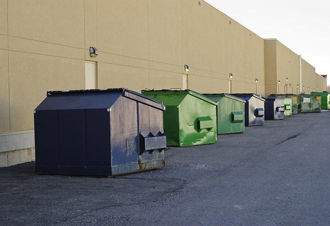 an assortment of sturdy and reliable waste containers near a construction area in Hernando